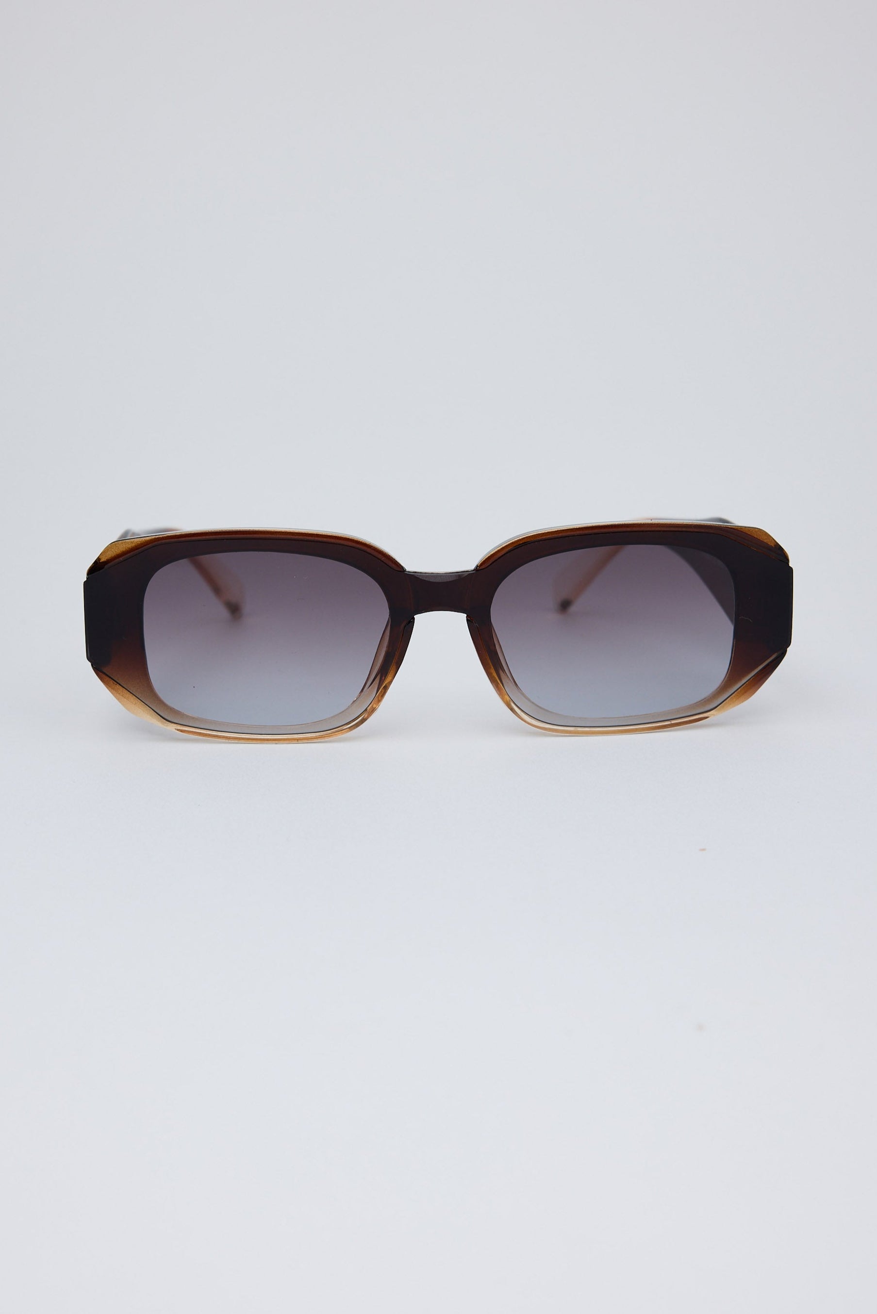Sunglasses with a tortoiseshell frame on a white background