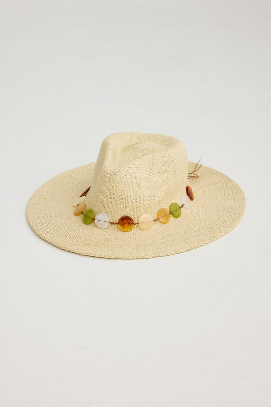 Beige straw hat with colorful bead embellishments on a light gray background