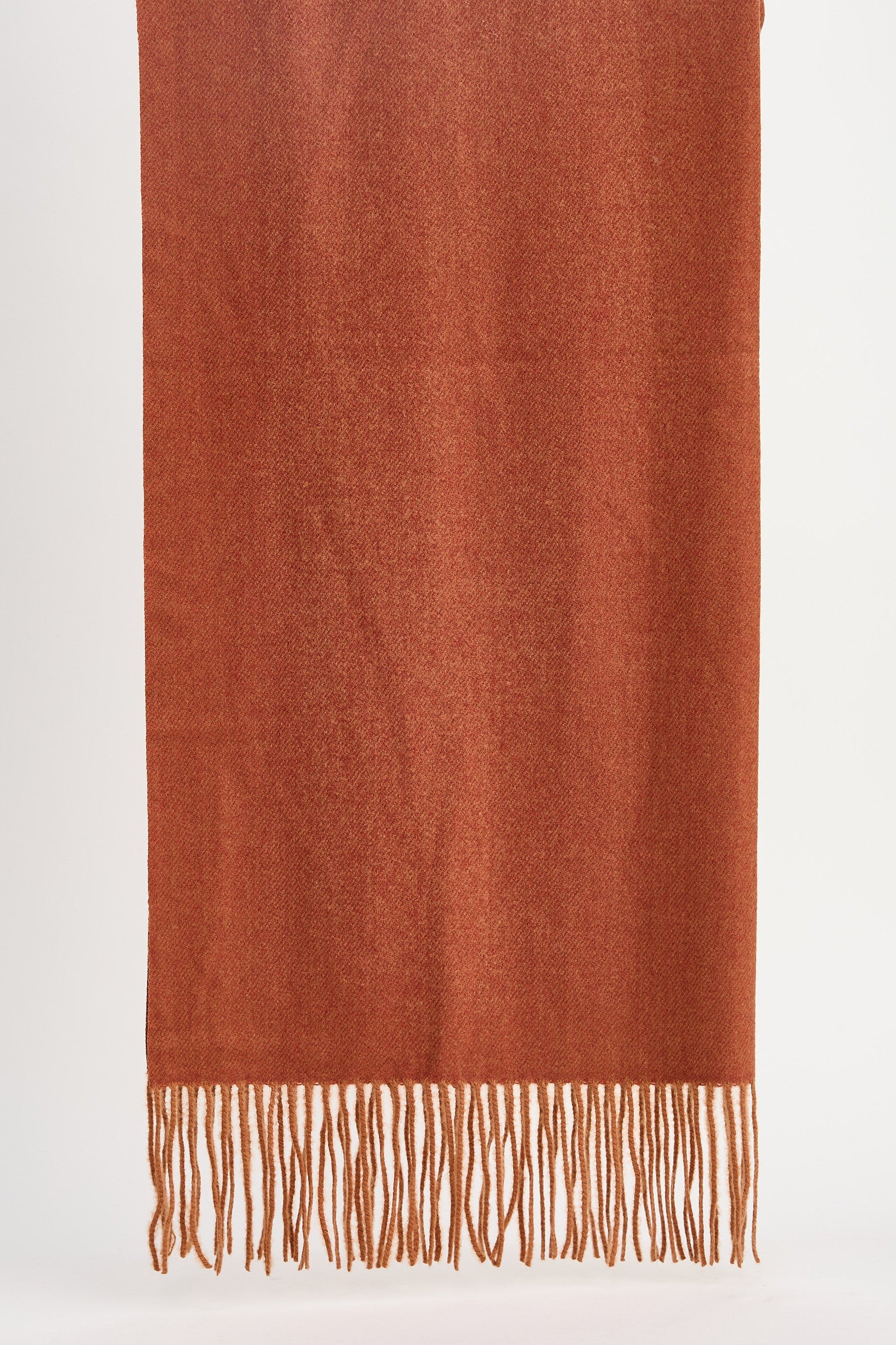 Brown scarf with fringes on a white background
