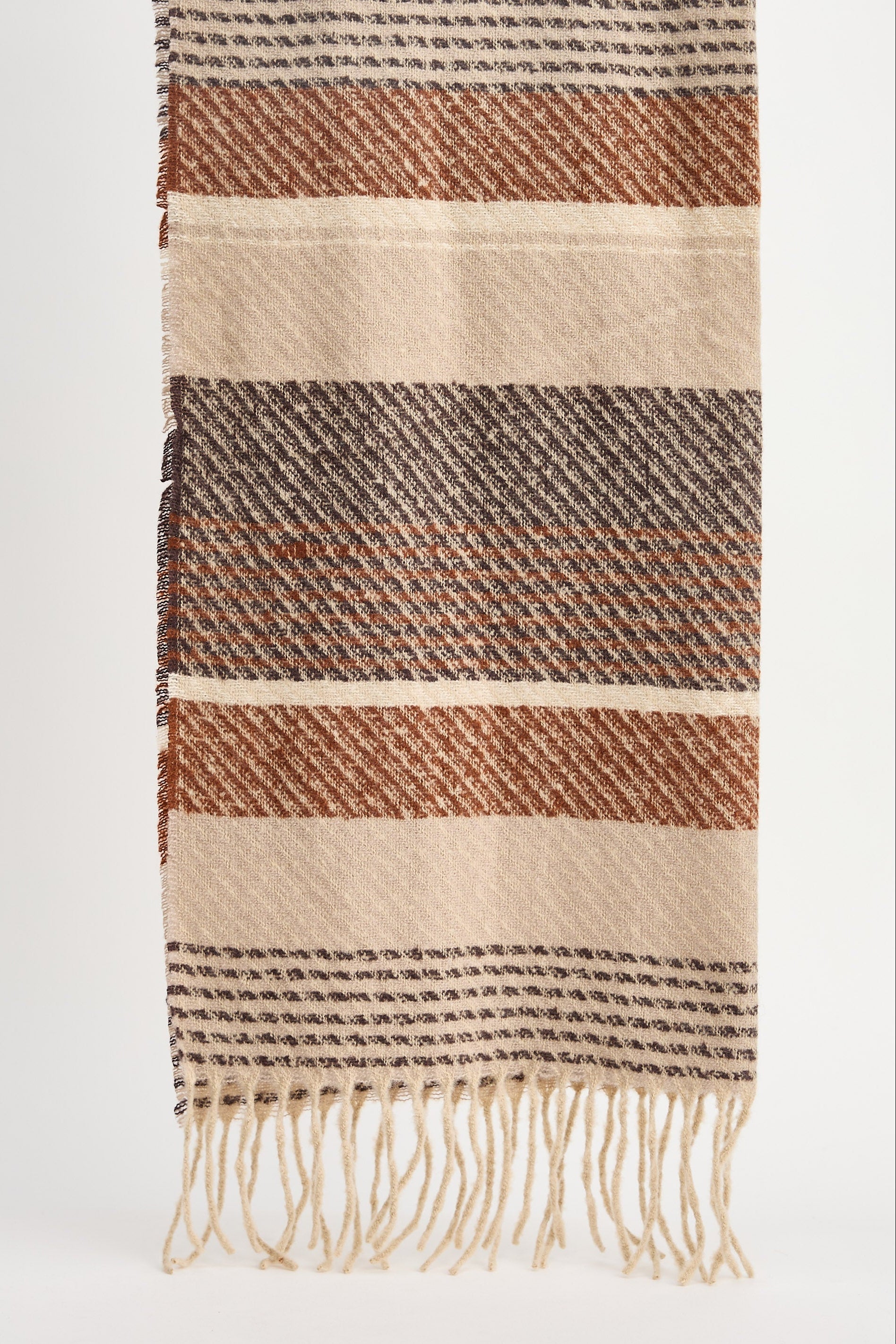 Striped woven scarf with fringes on a white background