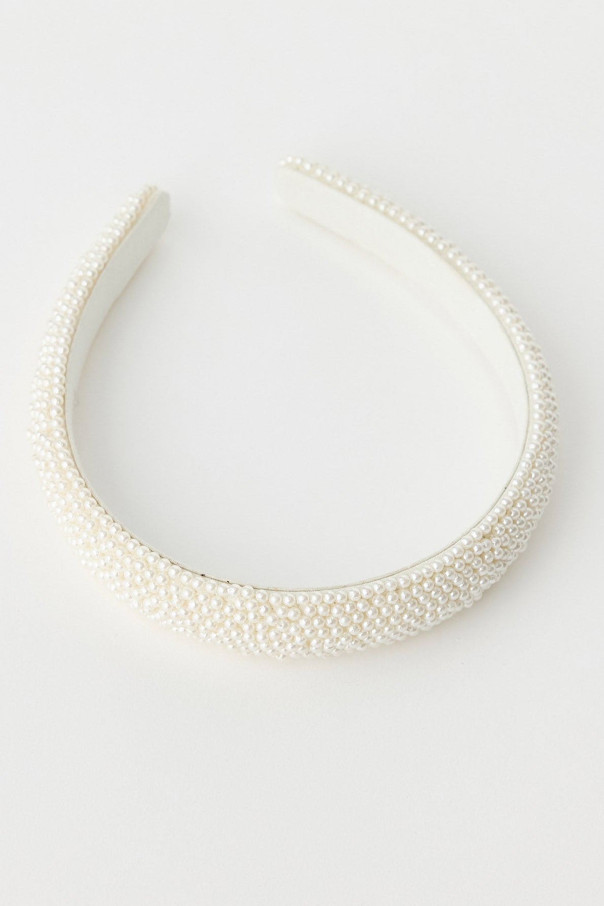 White headband on a light gray background