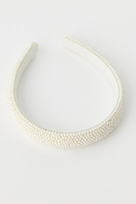 White headband on a light gray background