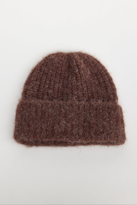 Brown knit beanie on a white background