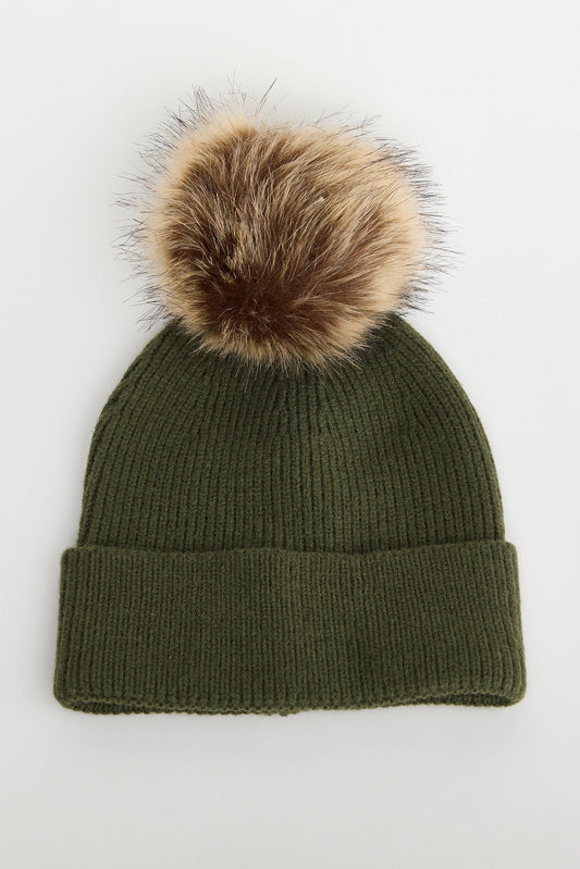 Green knit beanie with a fur pom-pom on a white background