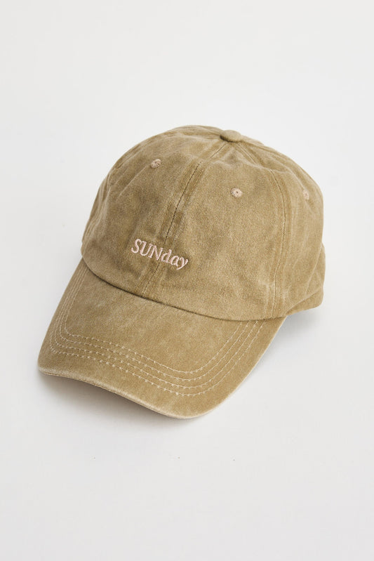 Beige cap with 'SUNDAY' embroidery on a white background