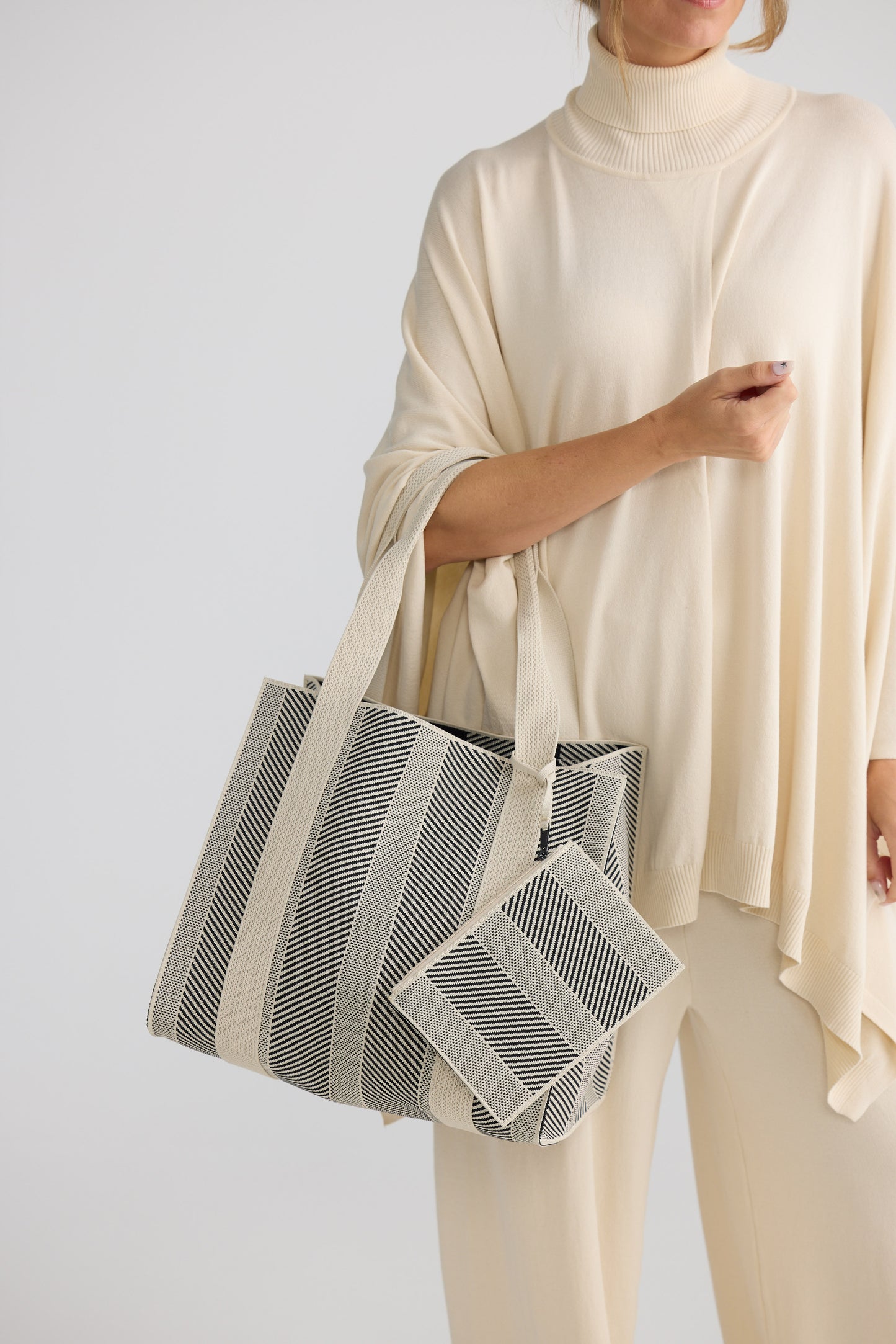 Bellagio Tote Bag - Black tote bag in black with geometric weave, styled view on white background