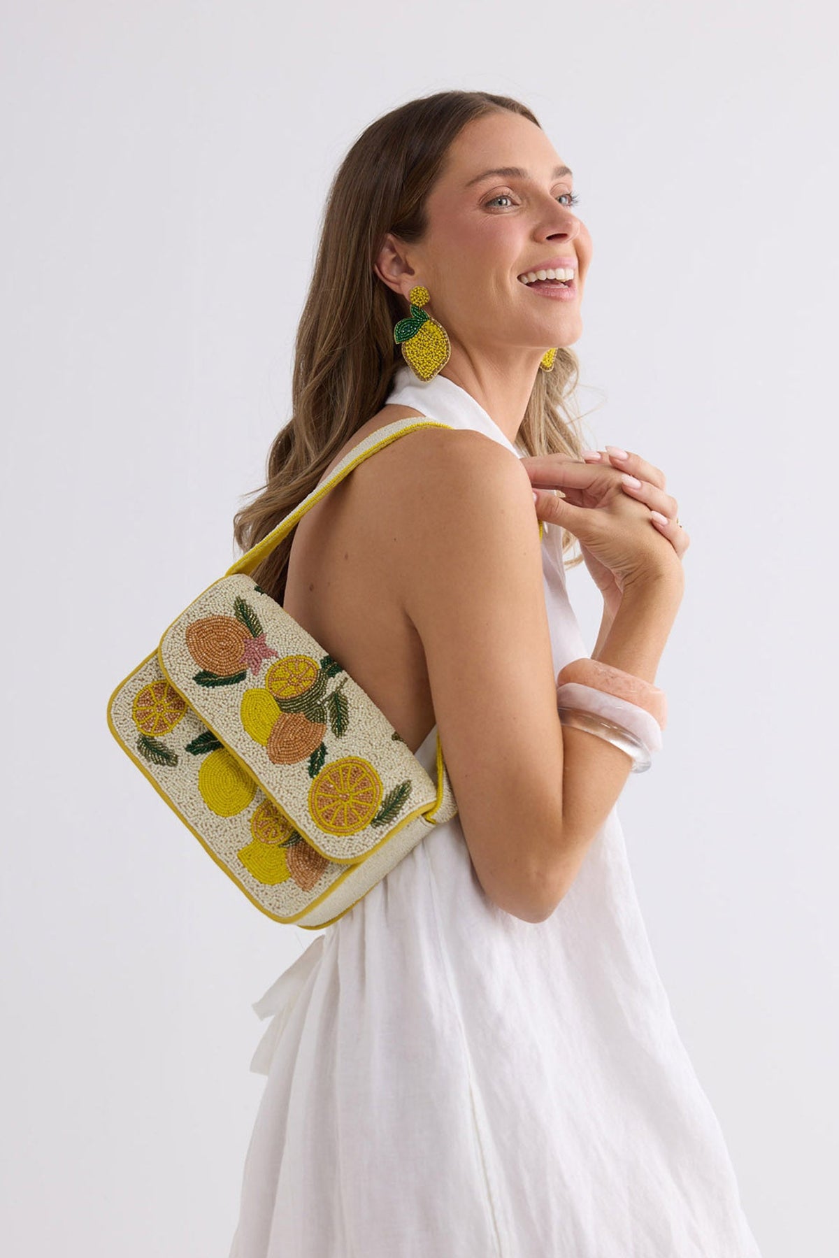 Life Gives You Lemons Shoulder Bag in yellow, front view.