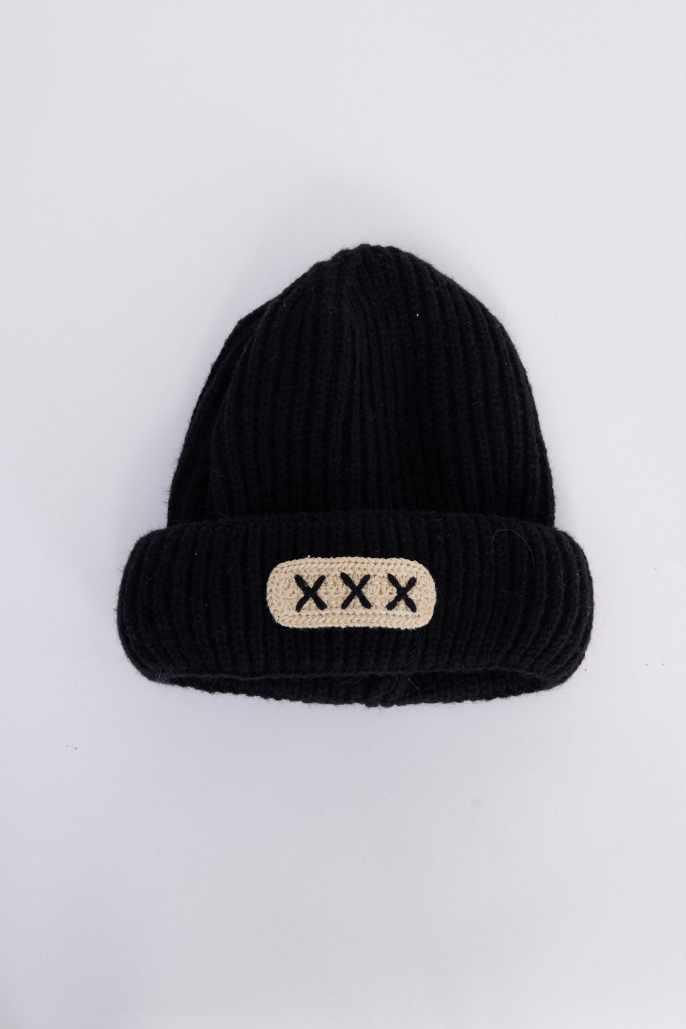 Benny Kids Beanie - Black kids' beanie in black with rib knit texture, front view on white background