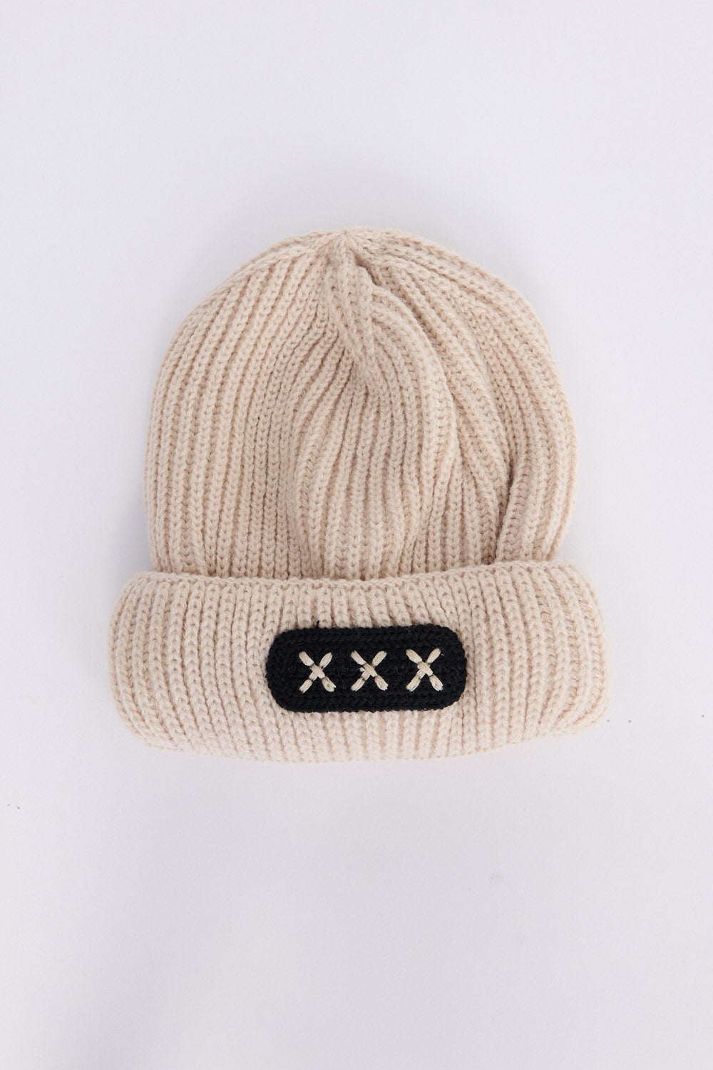 Benny Kids Beanie - Stone kids' beanie in stone with rib knit texture, front view on white background