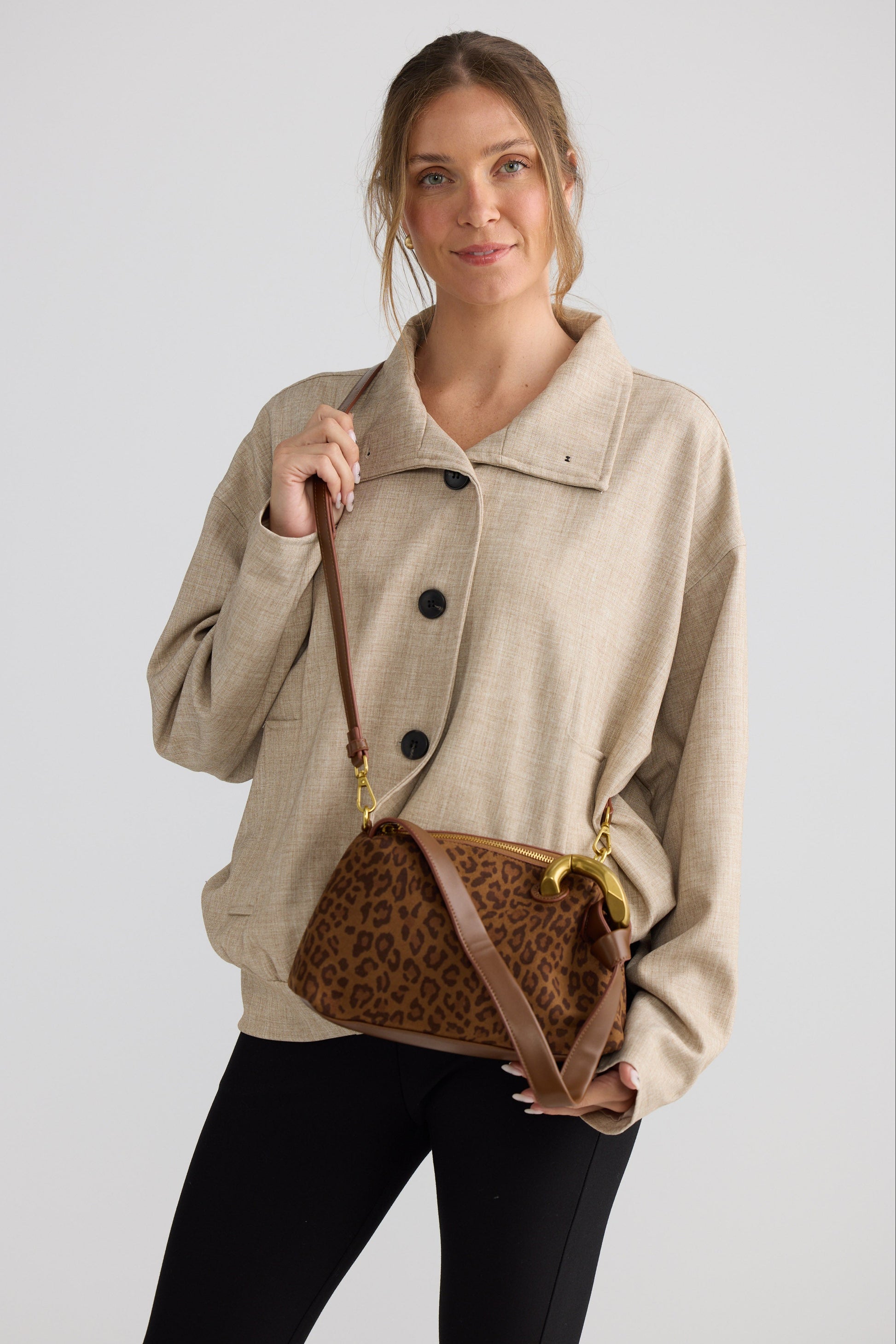 Lola Handbag - Leopard handbag in leopard with leopard print, side view on white background