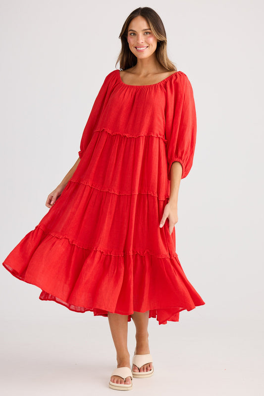 Woman wearing a red dress on a white background
