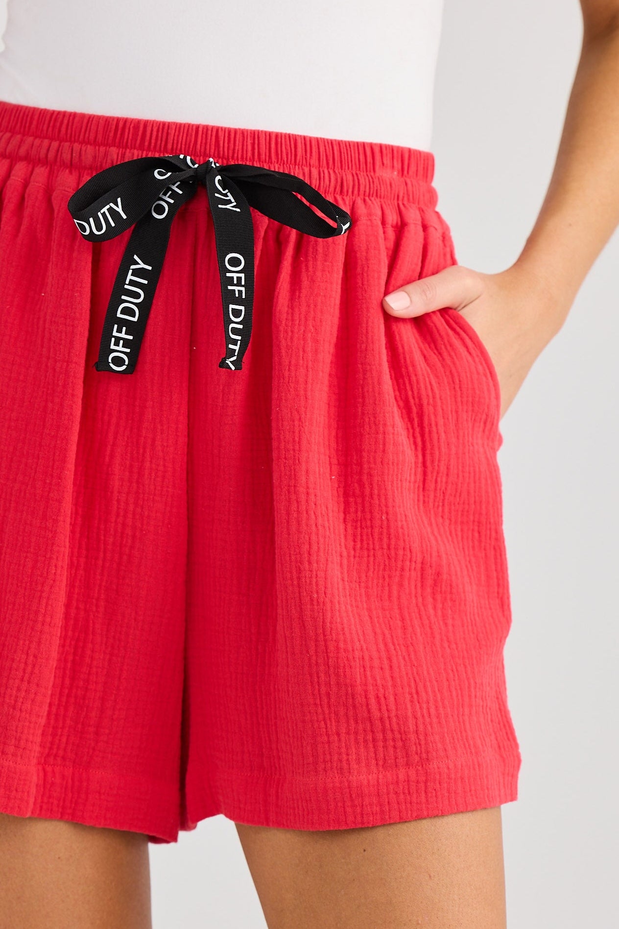 Red shorts with a brand logo on a white background