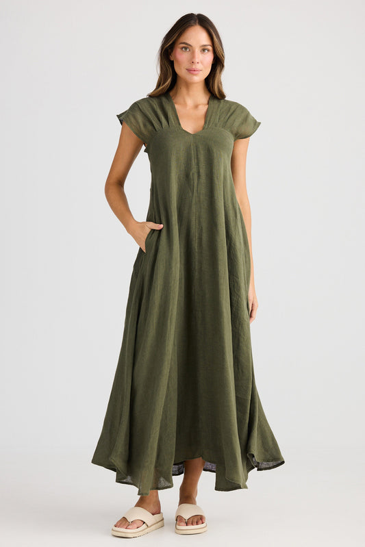 Woman wearing a green dress on a white background
