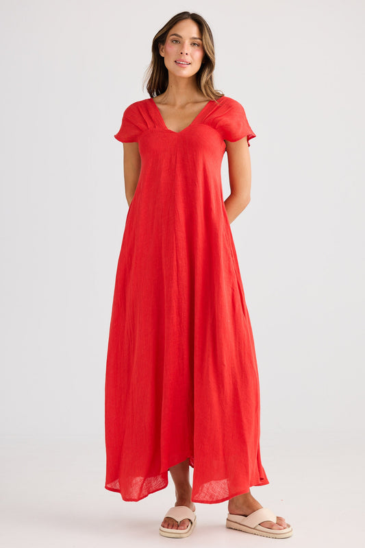 Woman wearing a red dress on a white background