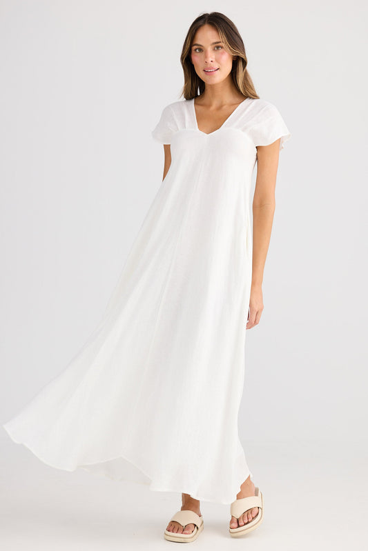 Woman wearing a white dress on a white background