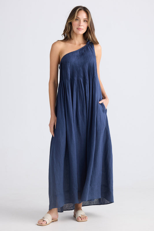 Female wearing one shoulder maxi dress in navy on white background