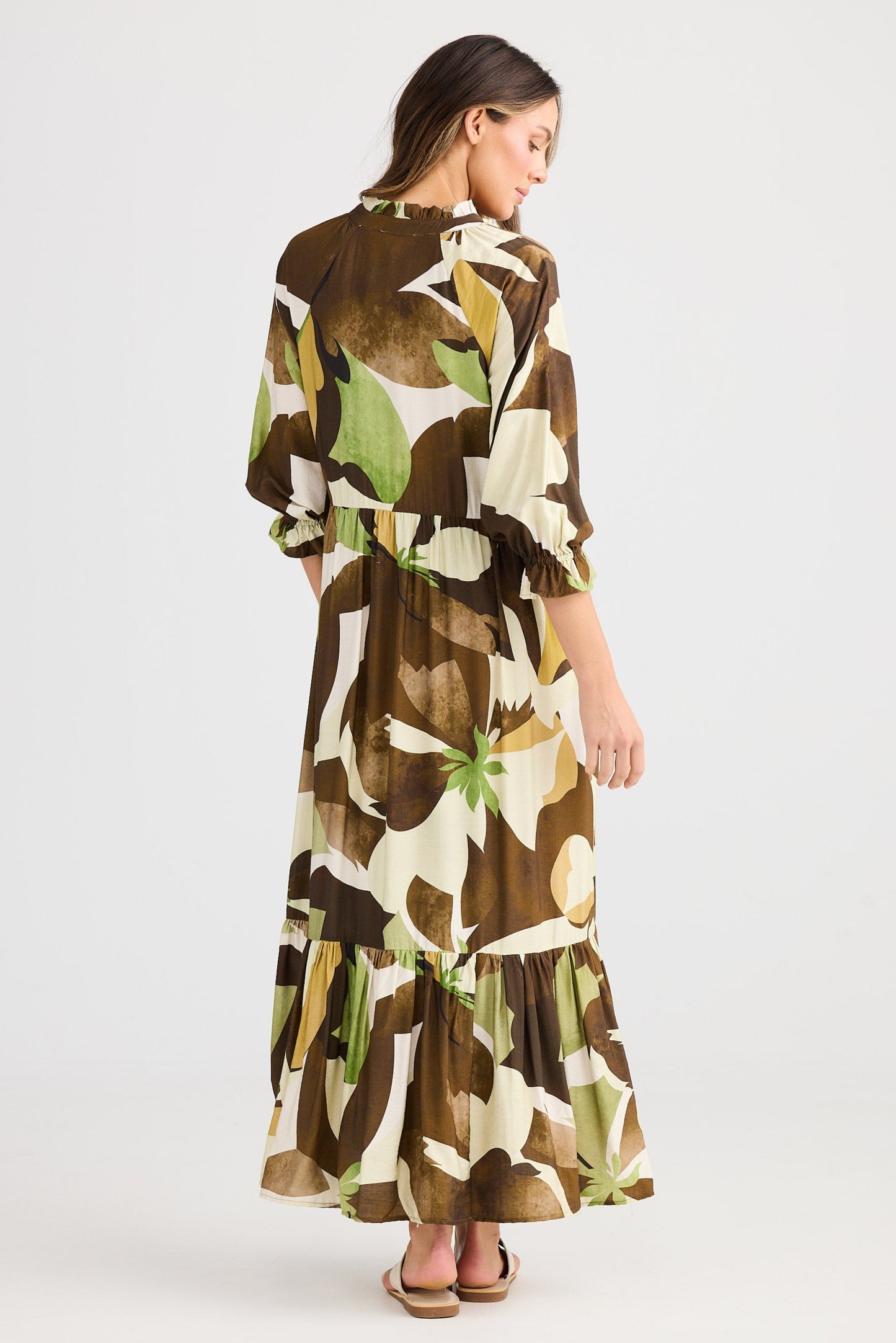 Woman wearing a floral dress on a white background