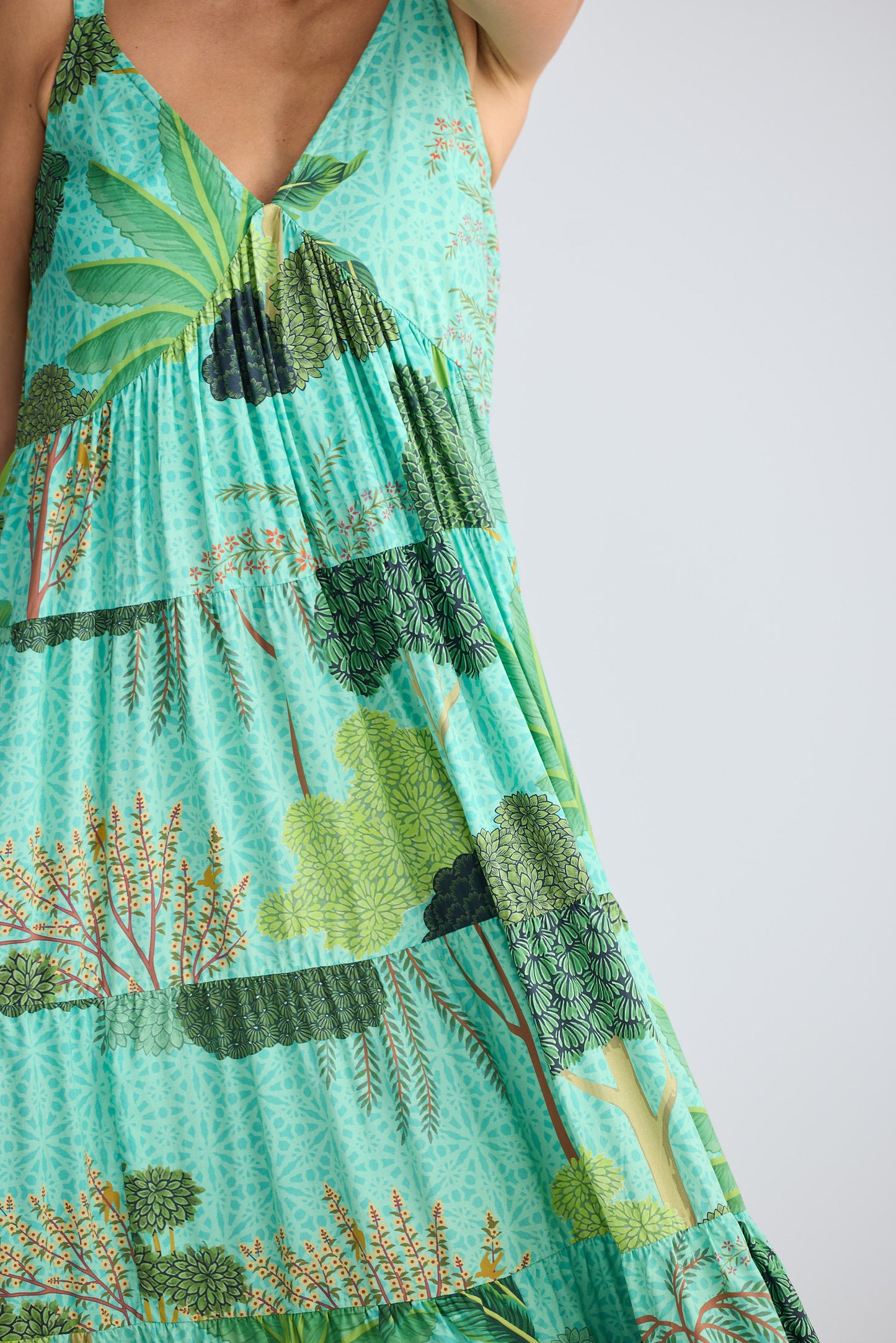 Green dress with nature print on a white background