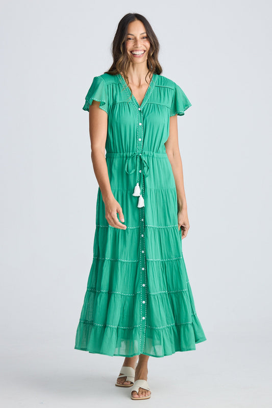 Woman wearing a green dress on a white background