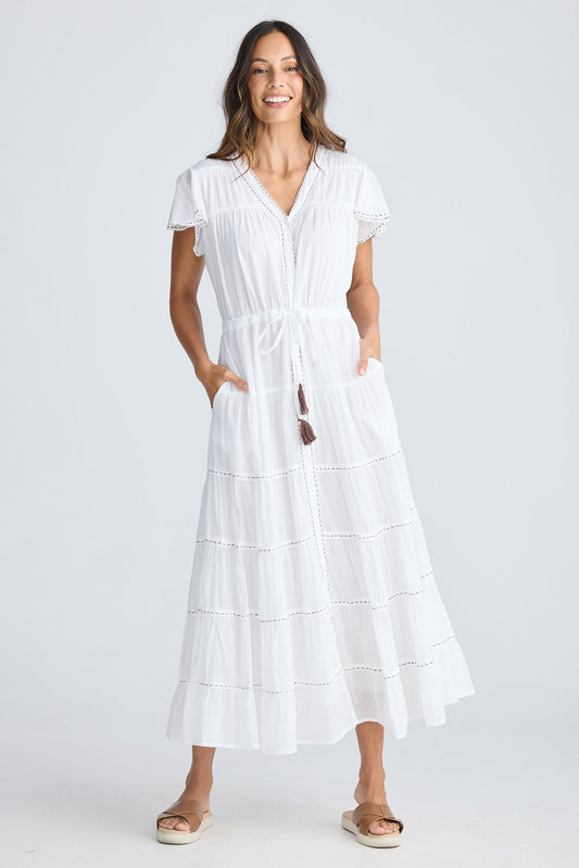 Woman wearing a white dress on a white background