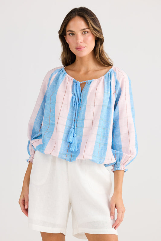Woman wearing a striped blouse with a white background