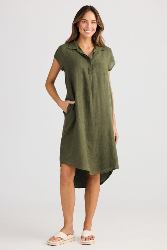 Woman wearing a green dress with a white background