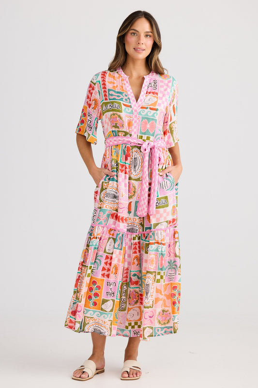Woman wearing a colorful patterned dress on a white background