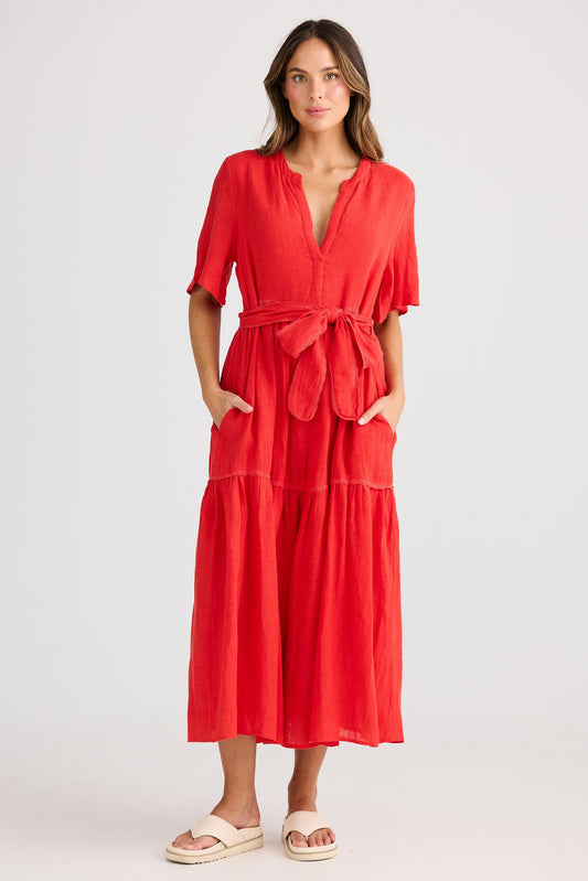 Woman wearing a red dress on a white background
