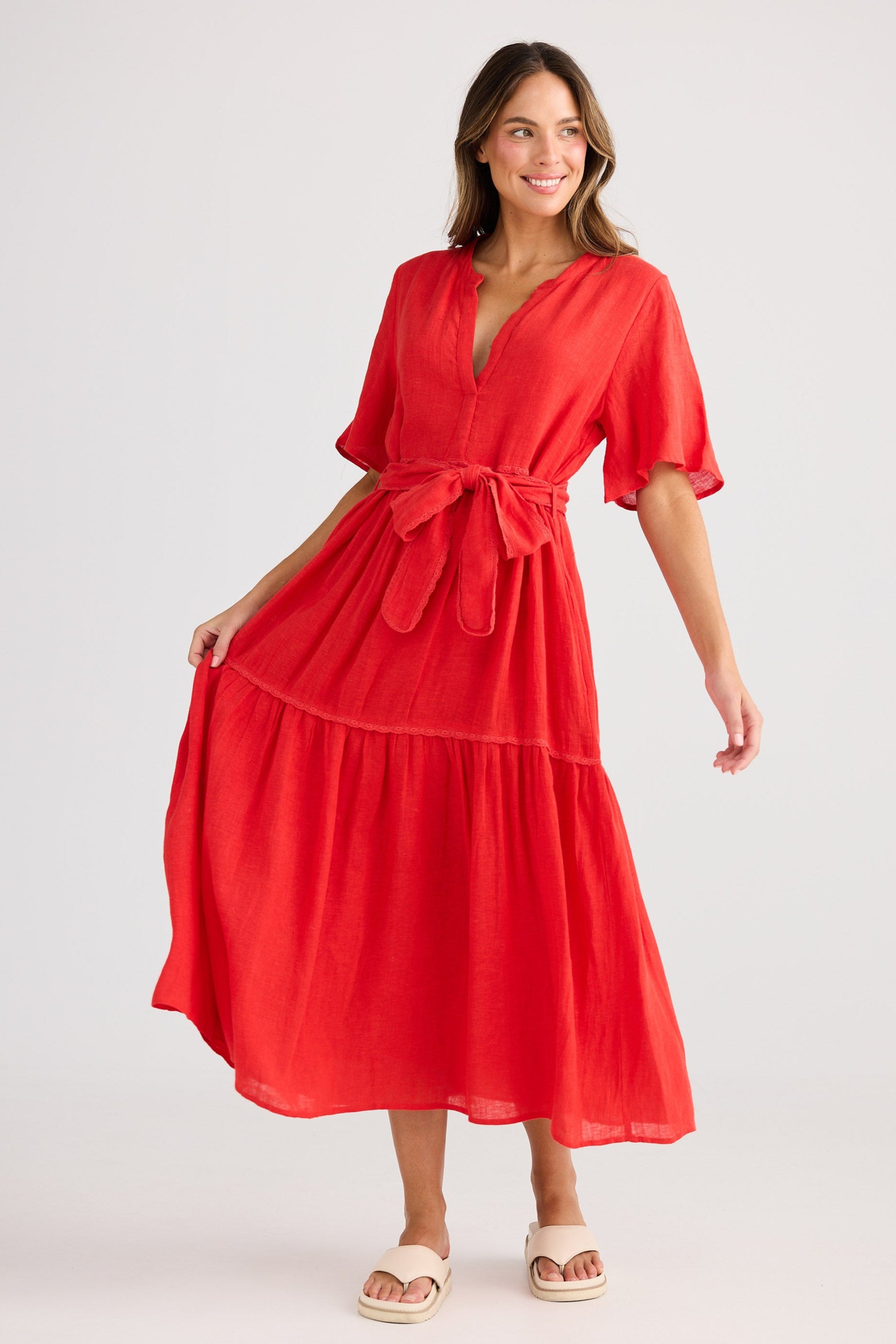 Woman wearing a red dress on a white background