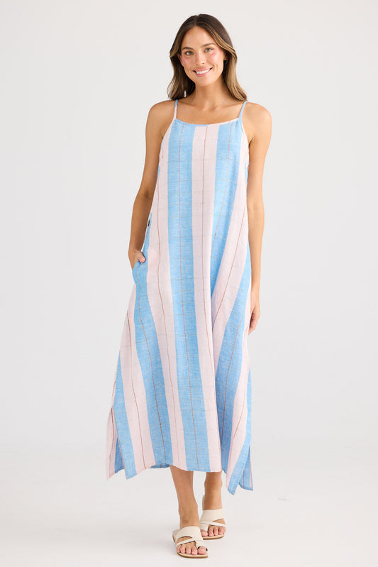 Woman wearing a striped dress on a white background