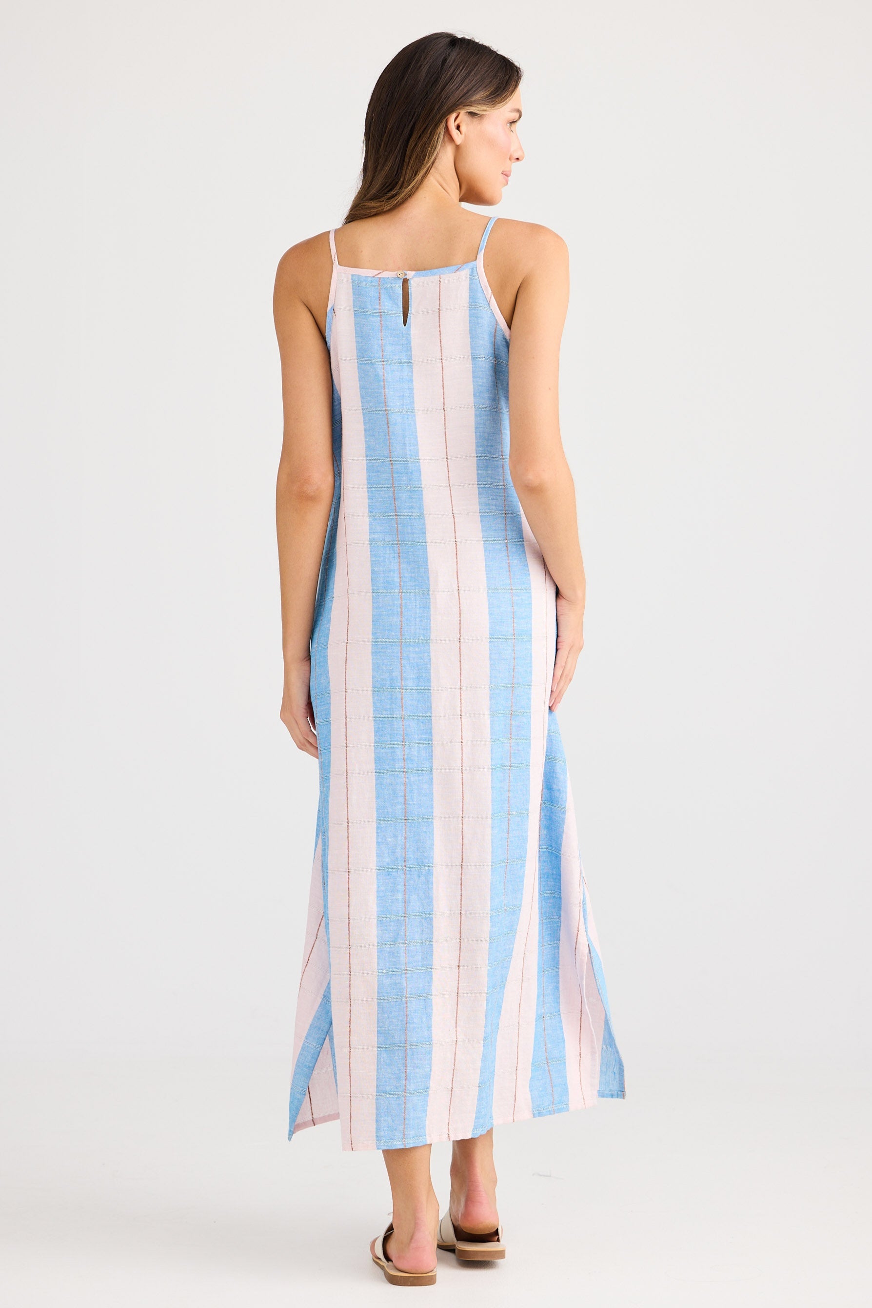 Woman wearing a striped dress on a white background
