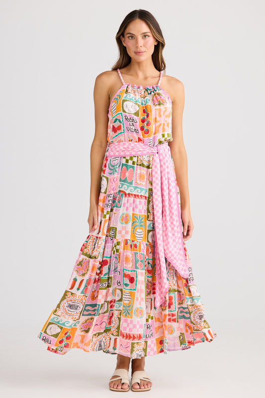 Woman wearing a colorful patterned dress on a white background