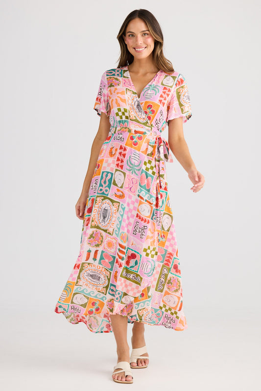 Woman wearing a colorful patterned dress on a white background