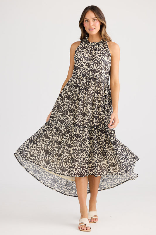 Woman wearing a floral dress on a white background