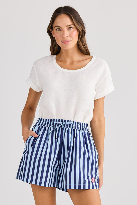 Woman wearing a white t-shirt and blue striped shorts on a white background
