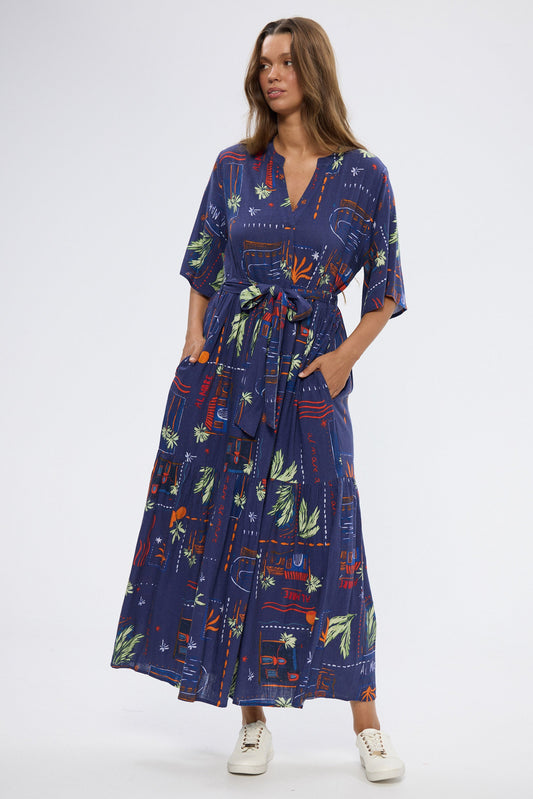 Woman wearing a blue floral dress on a white background