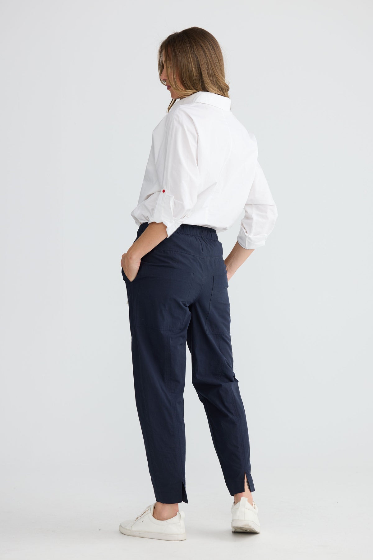 Reva Cargo Pant in Navy with front and back design seams with split at back hem.