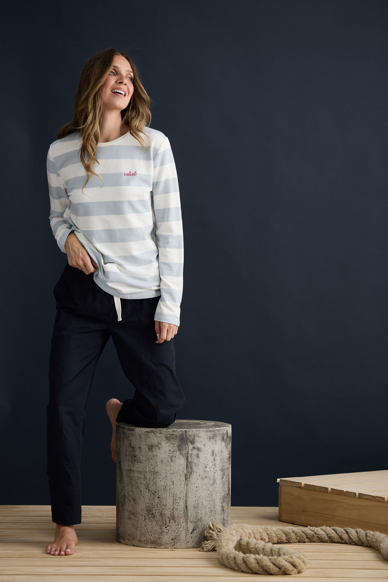 Model wearing Roam Tee Light Blue Stripe with long sleeves and striped finish, campaign lifestyle view