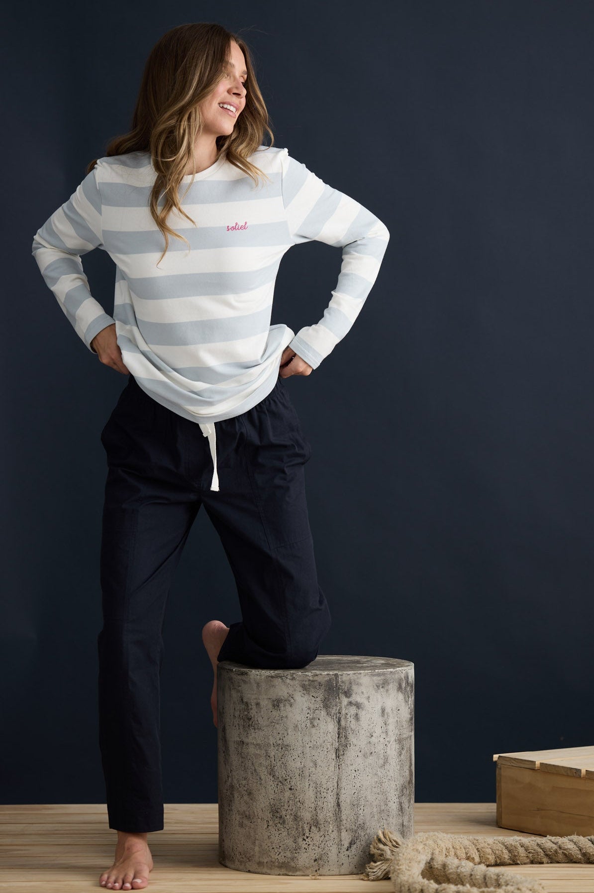Model wearing Roam Tee Light Blue Stripe with long sleeves and striped finish, campaign lifestyle view