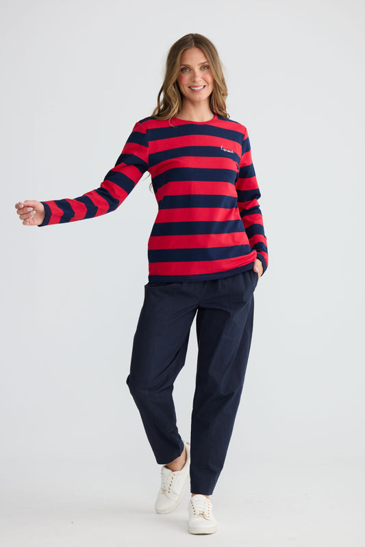 Model wearing Roam Tee Red and Navy Stripe with long sleeves and striped finish, front view on white background