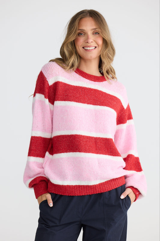 Model wearing Cove Knit Pink Multi Stripe with multi stripe knit finish, alternate view on white background