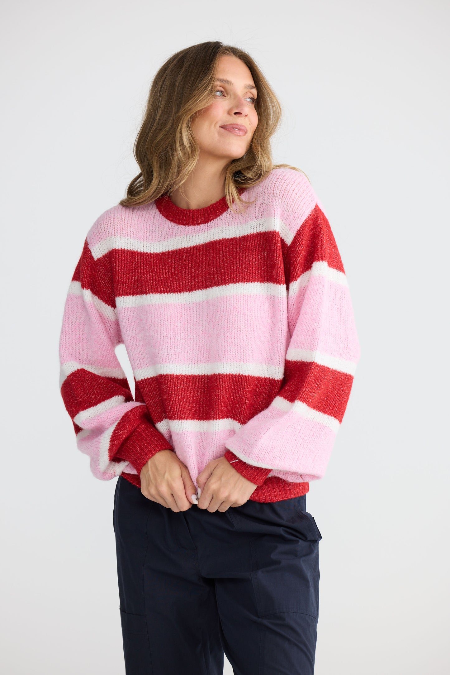 Model wearing Cove Knit Pink Multi Stripe with multi stripe knit finish, back view on white background