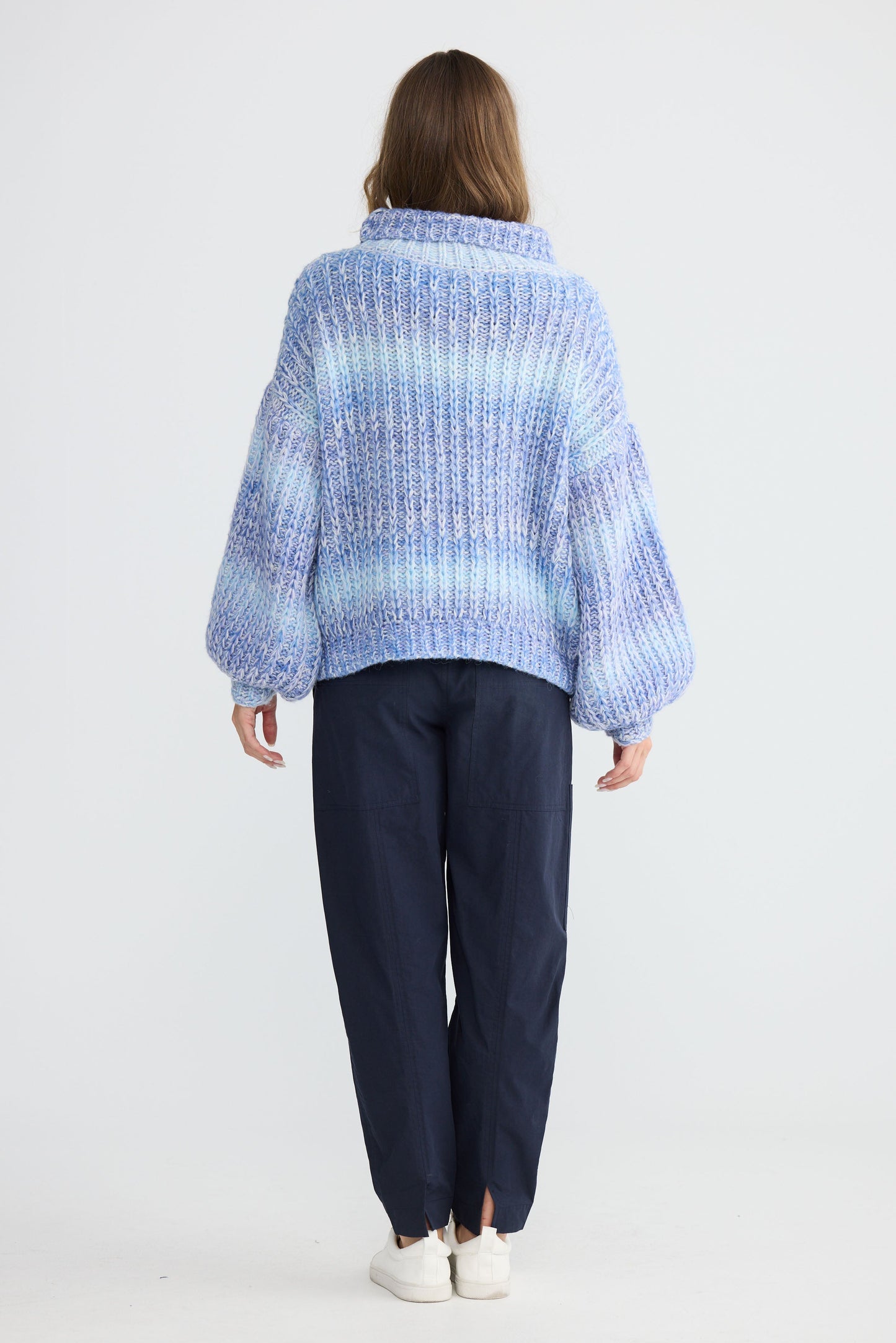 Model wearing Olas Knit Blue Ombre with chunky high neckline, front view on white background