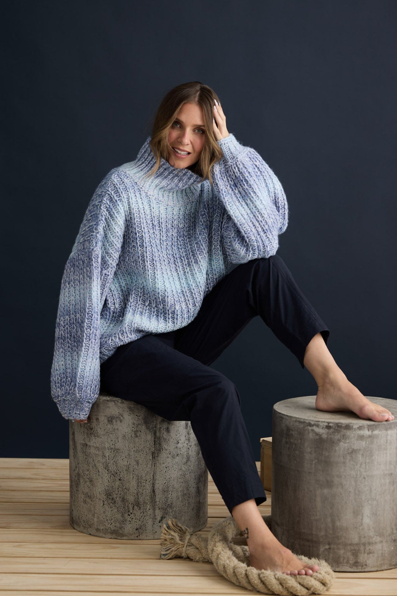 Model wearing Olas Knit Blue Ombre with chunky high neckline, campaign lifestyle view