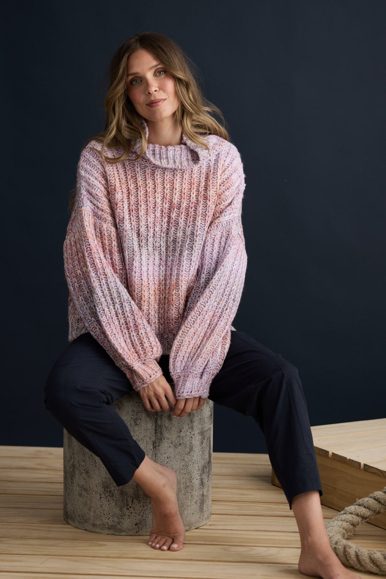 Model wearing Olas Knit Pink Ombre with chunky high neckline, campaign lifestyle view