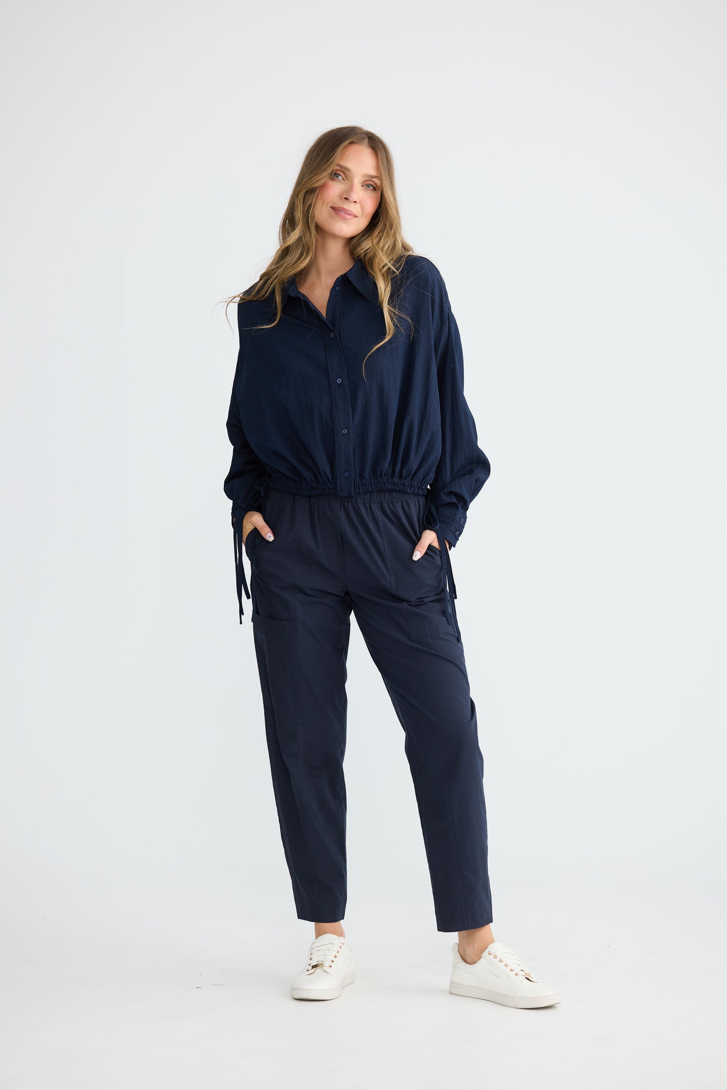 Model wearing Ripple Shirt Navy with relaxed shirt silhouette, full-length view on white background