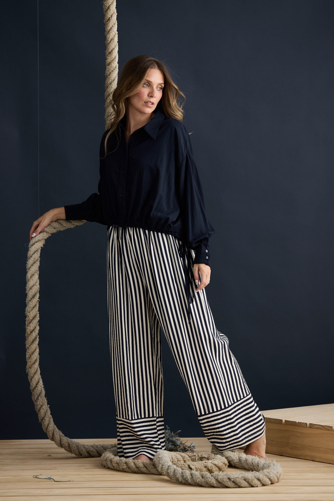 Model wearing Ripple Shirt Navy with relaxed shirt silhouette, campaign lifestyle view