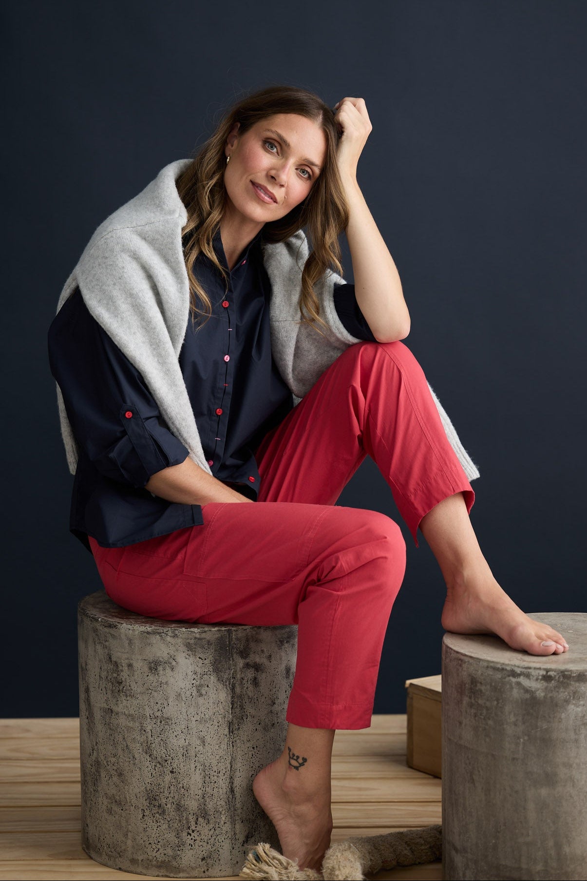 Model wearing Fae Shirt Navy with contrast buttons and stitching, campaign lifestyle view