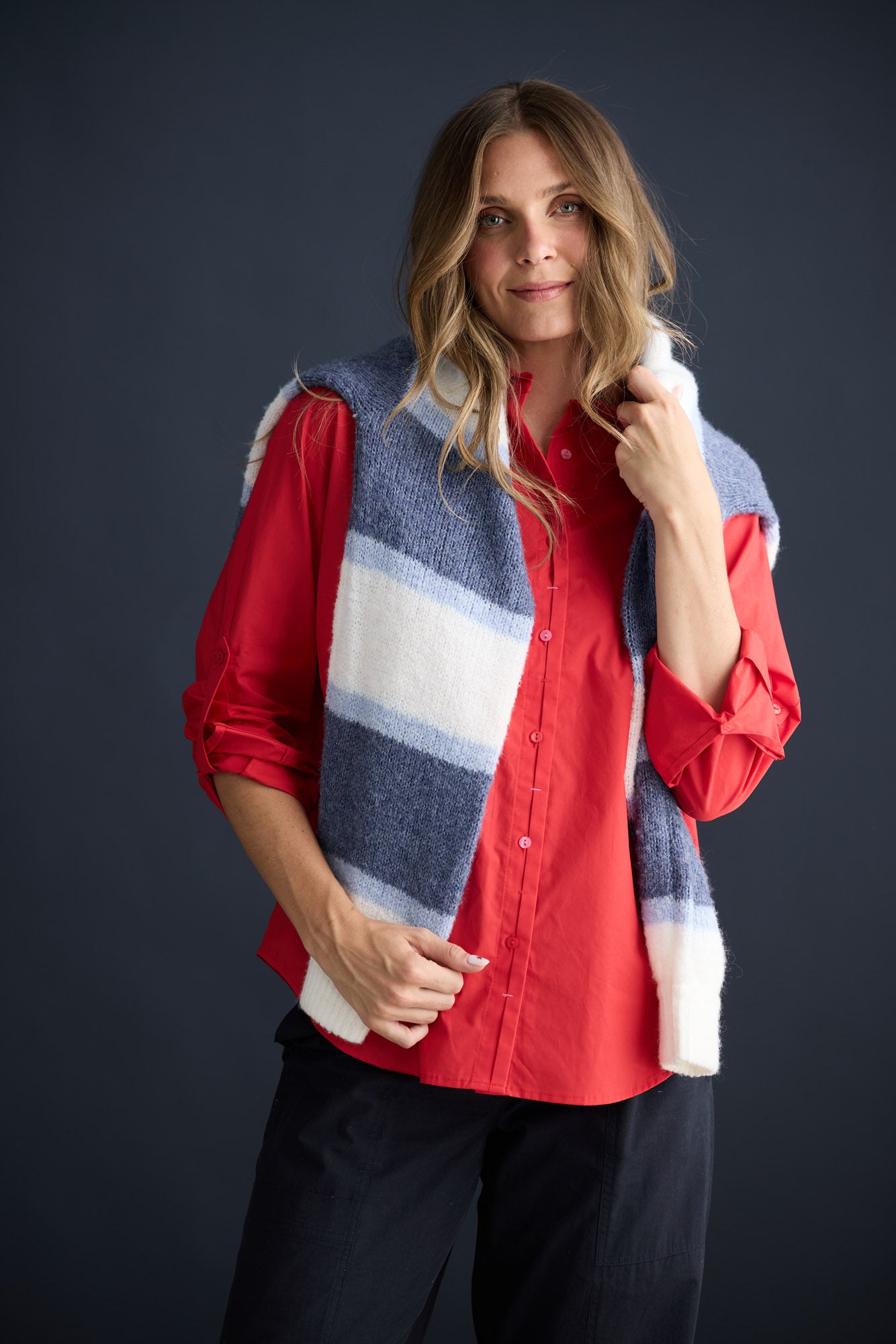 Model wearing Fae Shirt Red with contrast buttons and stitching, campaign lifestyle view