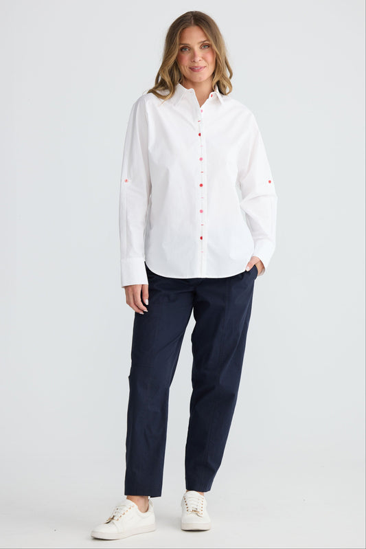Model wearing Fae Shirt White with contrast buttons and stitching, alternate view on white background